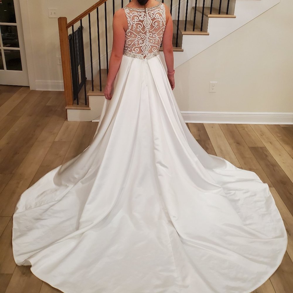 New unworn illusion back wedding dress